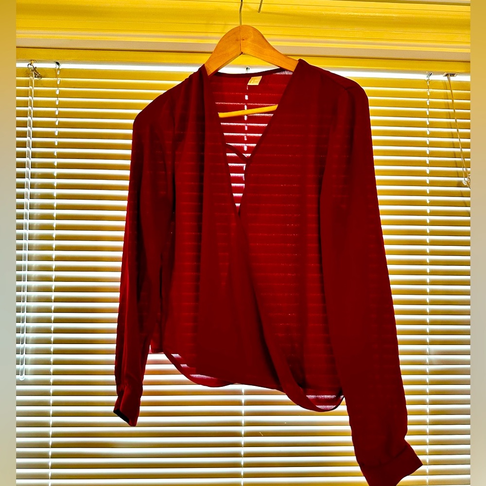 Red, low cut flowy blouse